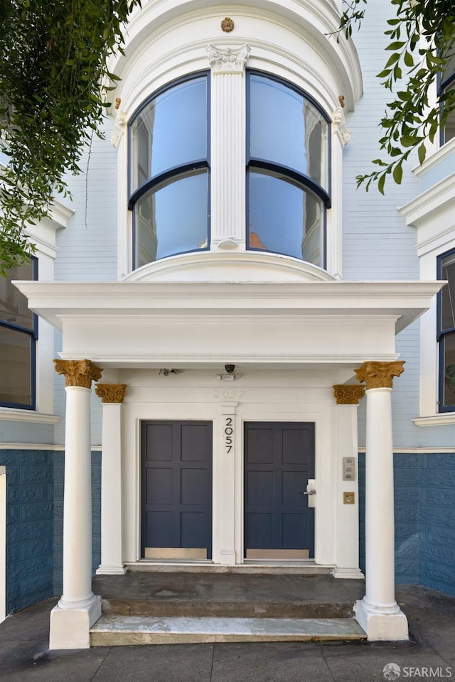 doorway to property featuring an attached garage