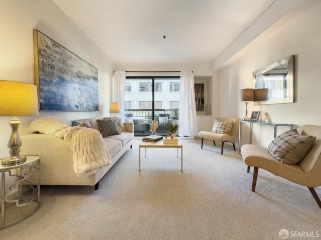 carpeted living room featuring plenty of natural light