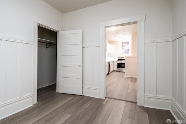 unfurnished bedroom with wood-type flooring