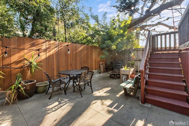 view of patio / terrace with a fire pit