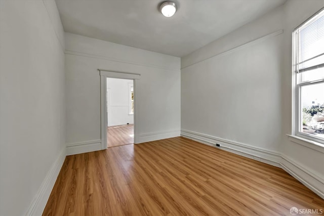 empty room with light wood-type flooring