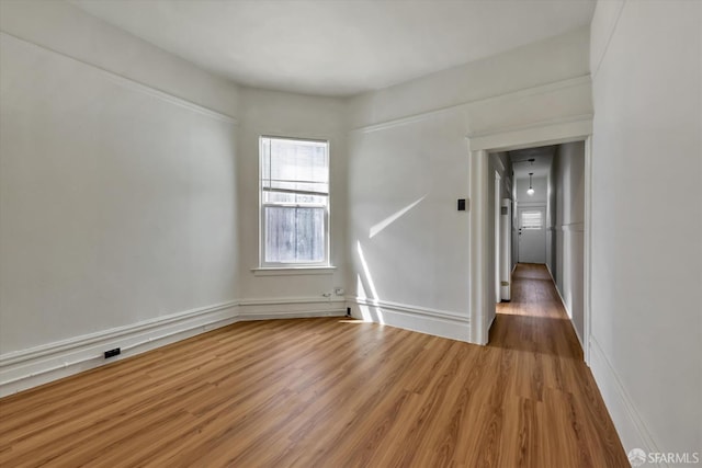 empty room featuring wood-type flooring