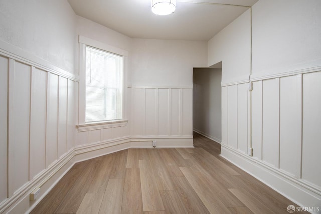 spare room featuring light wood-type flooring