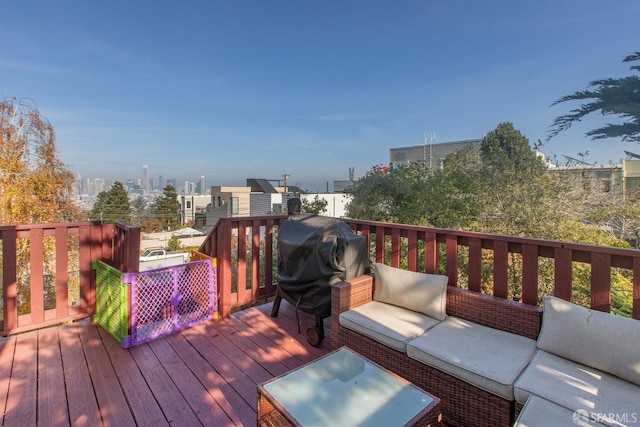 wooden deck featuring outdoor lounge area and area for grilling