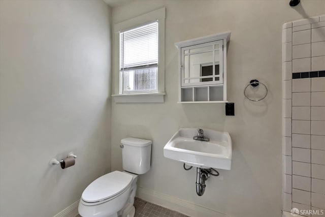 bathroom featuring sink and toilet