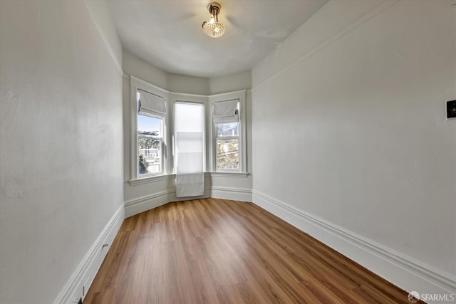 empty room featuring wood-type flooring