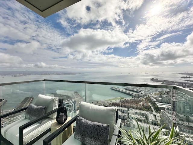 balcony featuring a water view