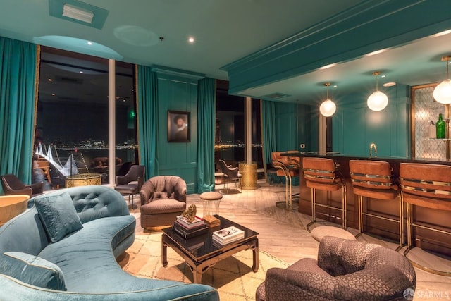 401 Harrison St Unit 48C, San Francisco, CA 94105 - cinema room with a community bar, wood finished floors, and a decorative wall
