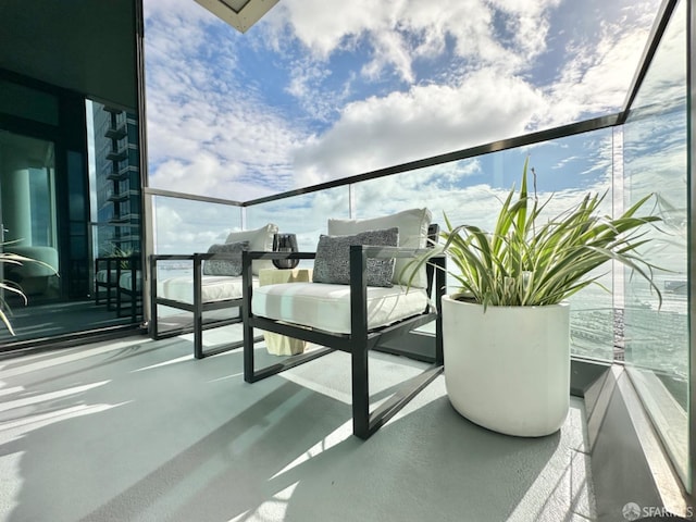 balcony featuring a water view