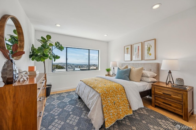 bedroom featuring wood finished floors and recessed lighting