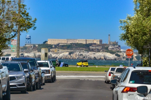 view of parking with a water view