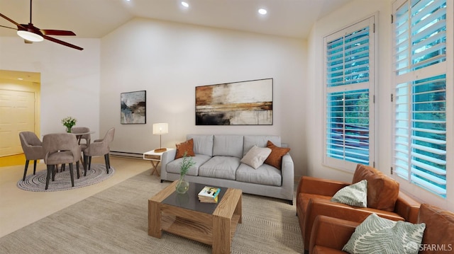 living room with a baseboard radiator, carpet flooring, high vaulted ceiling, and ceiling fan