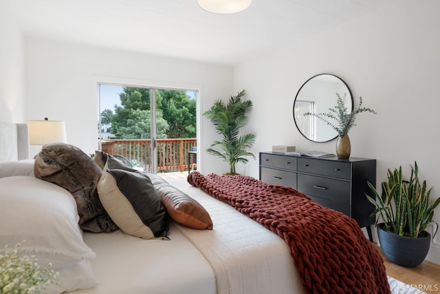 bedroom featuring access to exterior and light hardwood / wood-style floors