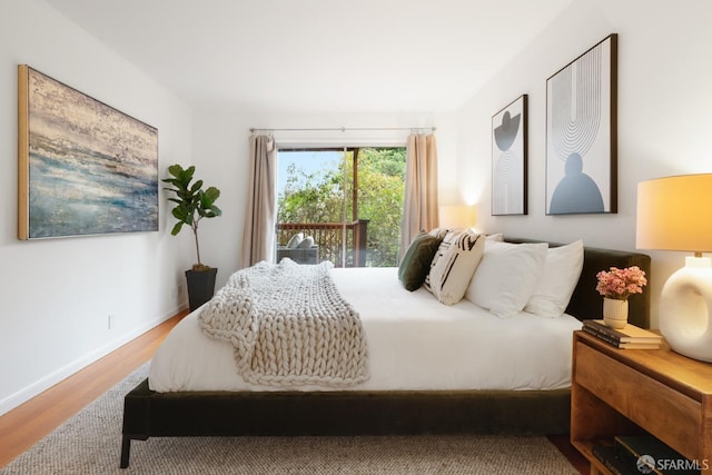 bedroom with wood-type flooring