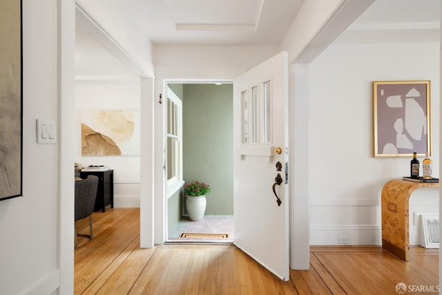 hallway with hardwood / wood-style floors