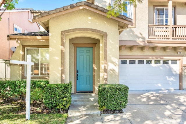 property entrance with a garage