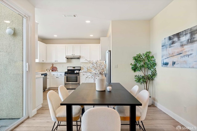 dining room featuring light hardwood / wood-style floors