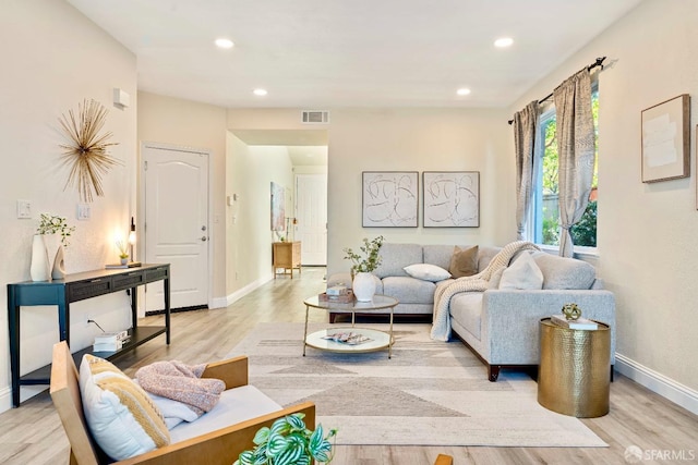 living room with light hardwood / wood-style floors