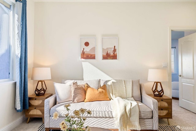 living room with light colored carpet and a wealth of natural light