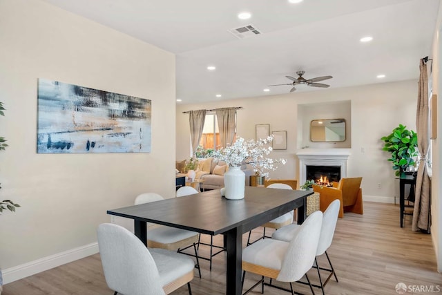 dining room featuring ceiling fan and light wood-type flooring