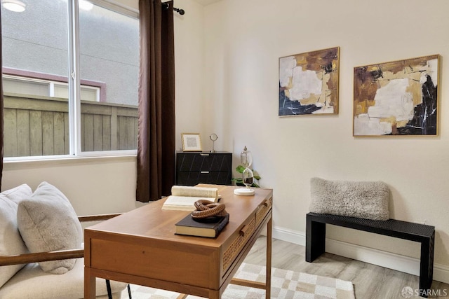 office space with light hardwood / wood-style flooring