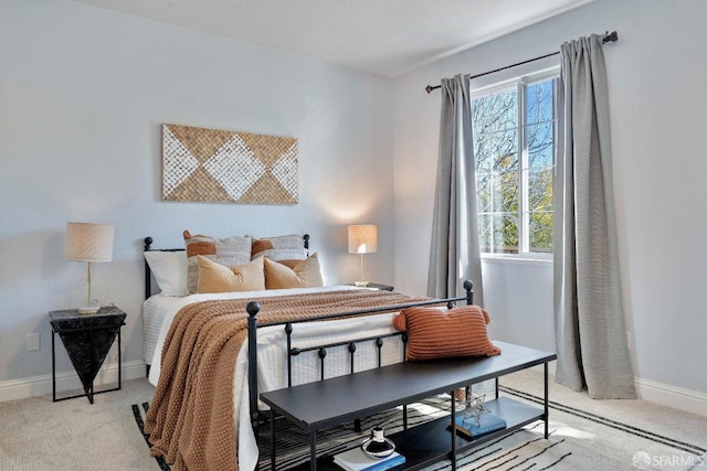 bedroom with light colored carpet