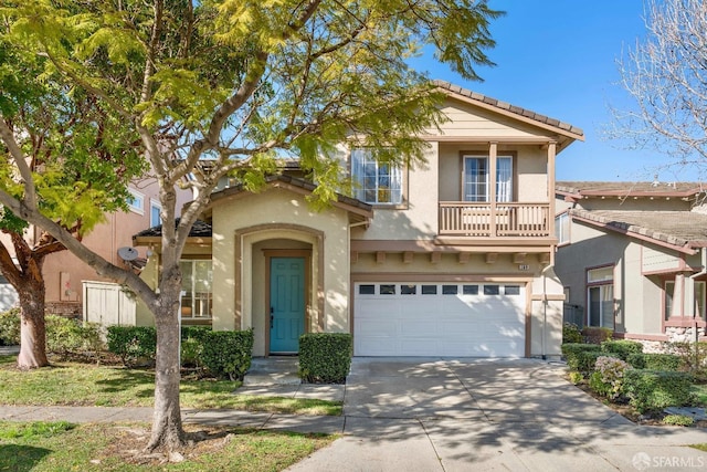 view of front of home with a garage and a balcony