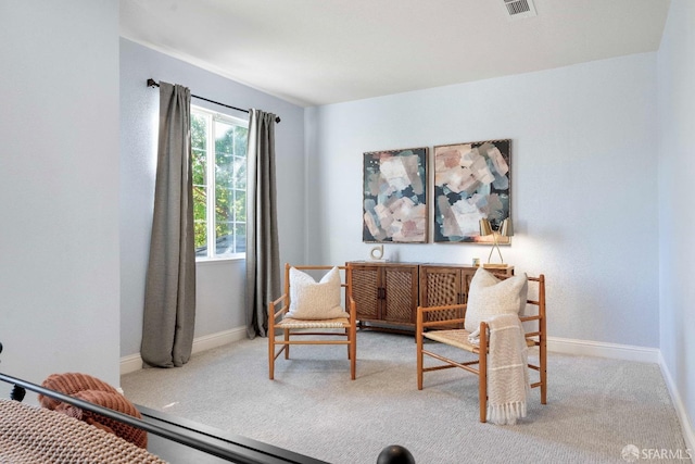 living area with light colored carpet