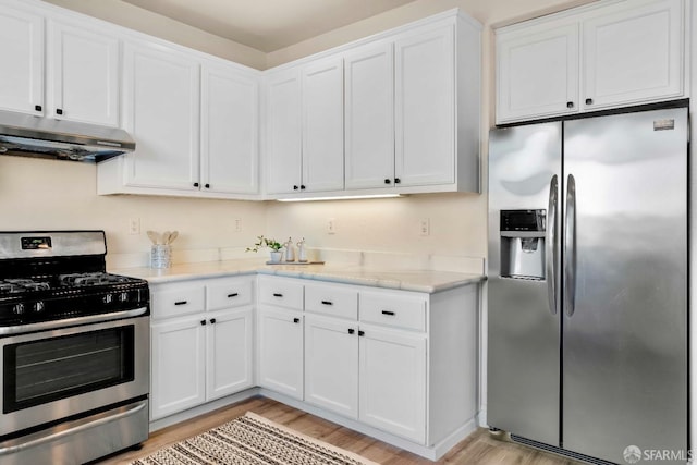 kitchen featuring white cabinetry, light wood-type flooring, and appliances with stainless steel finishes