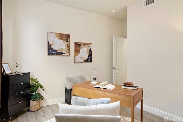 office area with light hardwood / wood-style floors