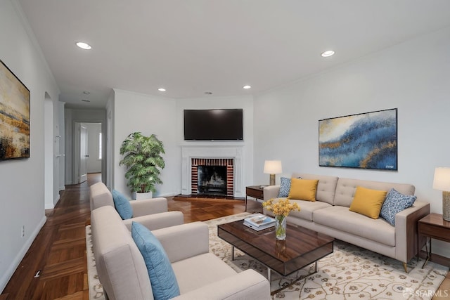 living room with baseboards, a fireplace, recessed lighting, and ornamental molding