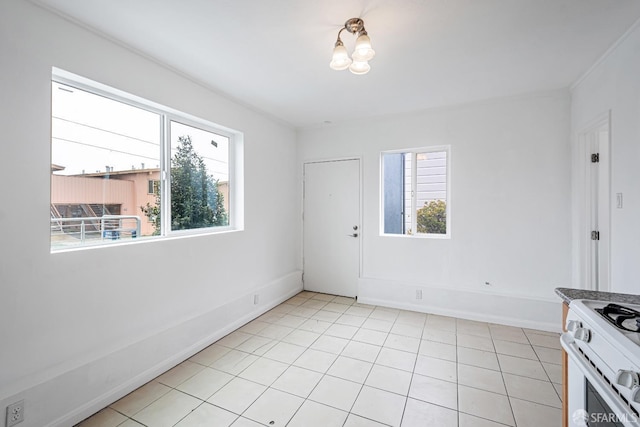 interior space featuring an inviting chandelier and light tile patterned floors