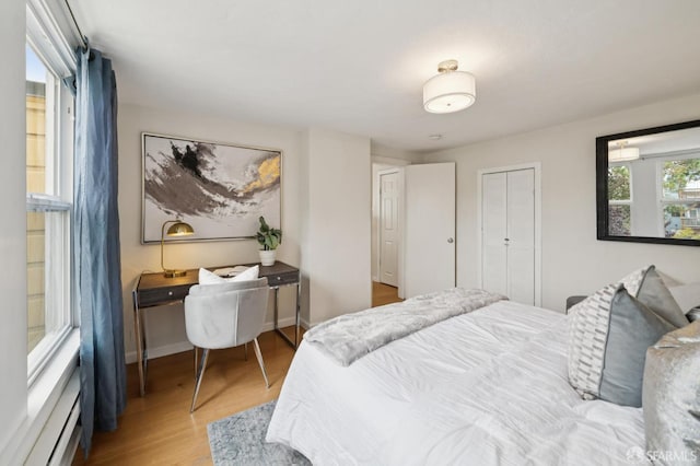 773 15th Ave, San Francisco, CA 94118 - bedroom featuring wood finished floors and a baseboard heating unit