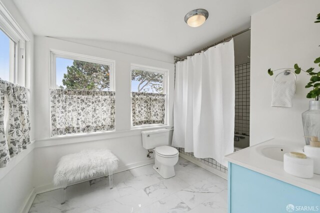 773 15th Ave, San Francisco, CA 94118 - full bath featuring healthy amount of natural light, marble look tiles, toilet, and vanity