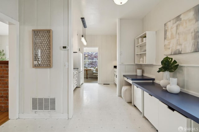 773 15th Ave, San Francisco, CA 94118 - kitchen with a decorative wall, white cabinets, dark countertops, light flooring, and open shelves