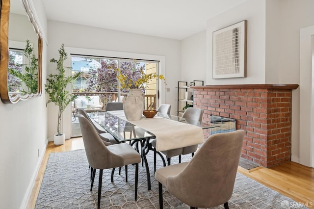 773 15th Ave, San Francisco, CA 94118 - dining area with wood finished floors, healthy amount of natural light, and a fireplace