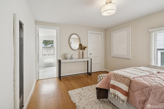 773 15th Ave, San Francisco, CA 94118 - bedroom with wood finished floors, baseboards, and a heating unit