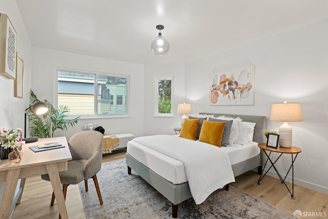 bedroom with light wood-type flooring