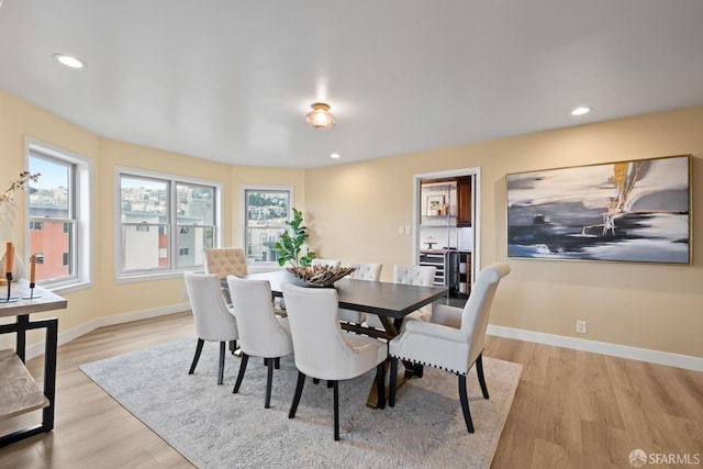 dining space with light wood-type flooring