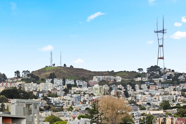 property's view of city with a mountain view