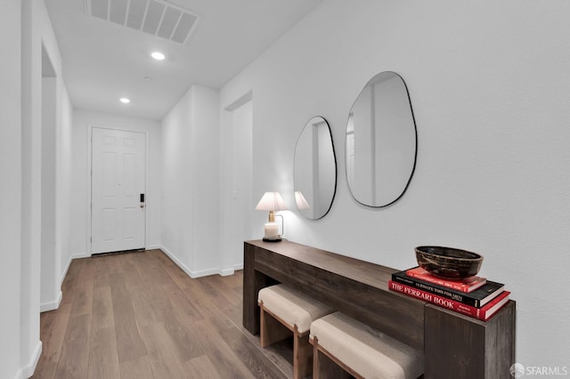 hallway featuring light hardwood / wood-style flooring