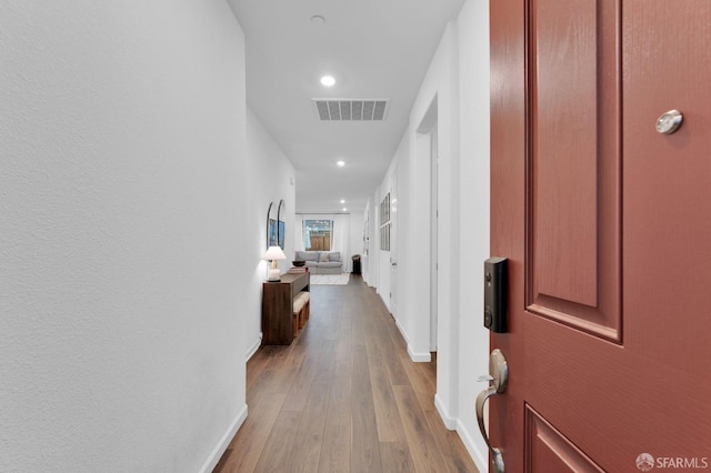 hallway featuring light hardwood / wood-style floors