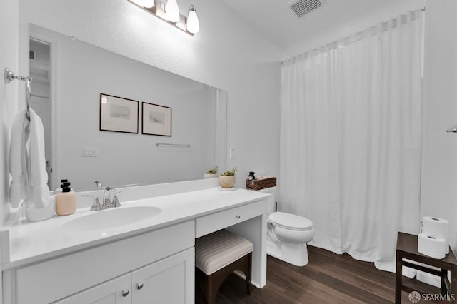 bathroom featuring vanity, toilet, a shower with shower curtain, and wood-type flooring