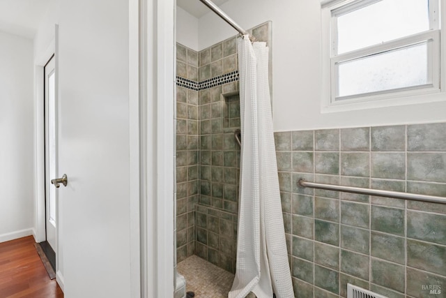 703 W St, Petaluma, CA 94952 - bathroom with a stall shower and wood finished floors