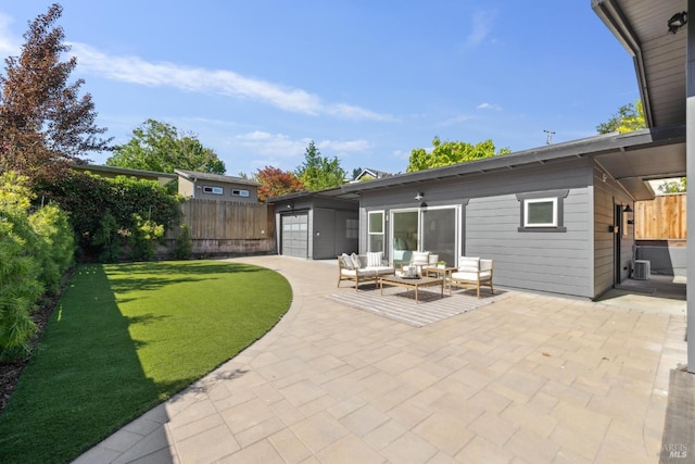703 W St, Petaluma, CA 94952 - rear view of house with a patio area, an outdoor living space, a fenced backyard, and an attached garage