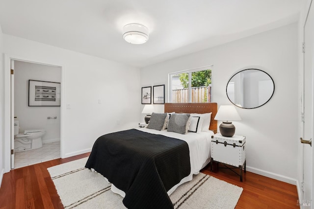 703 W St, Petaluma, CA 94952 - bedroom with wood finished floors and ensuite bathroom