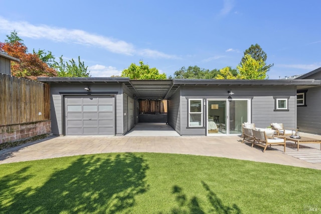 703 W St, Petaluma, CA 94952 - back of house featuring an attached garage and an outdoor hangout area