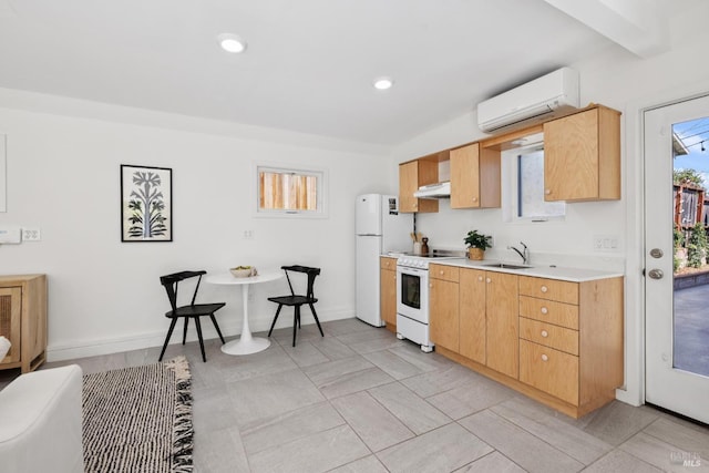 703 W St, Petaluma, CA 94952 - kitchen featuring white appliances, an AC wall unit, under cabinet range hood, light countertops, and light brown cabinets