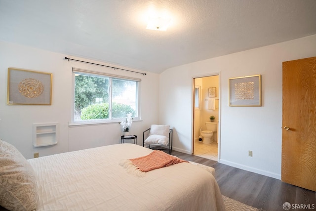 4301 Hillview Dr, Pittsburg, CA 94565 - bedroom featuring wood finished floors, baseboards, and connected bathroom