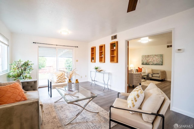 4301 Hillview Dr, Pittsburg, CA 94565 - living area with baseboards, wood finished floors, visible vents, and a wealth of natural light